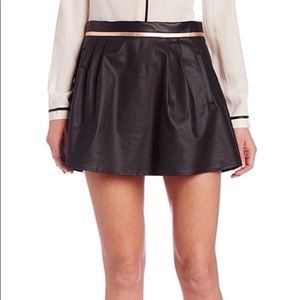 NWT BCBG Generation faux leather skirt with gold trim.